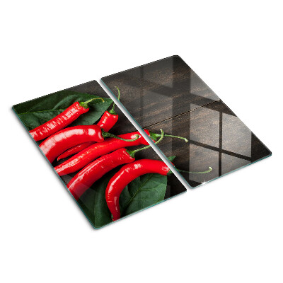 Snijplanken glas Chilipepers op een houten achtergrond