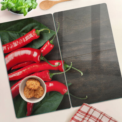 Snijplanken glas Chilipepers op een houten achtergrond