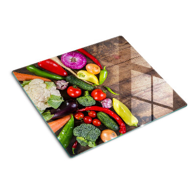 Snijplanken glas Groenten op een houten achtergrond