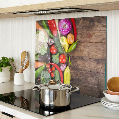 Snijplanken glas Groenten op een houten achtergrond
