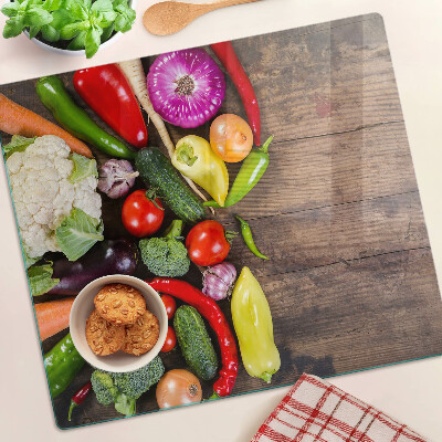 Snijplanken glas Groenten op een houten achtergrond