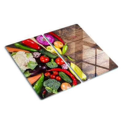 Snijplanken glas Groenten op een houten achtergrond