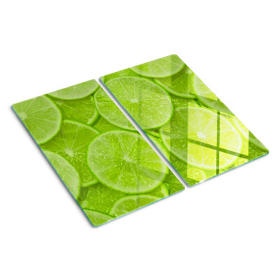 Glazen snijplanken Limoenschijfjes op een groene achtergrond