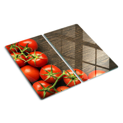 Glazen snijplanken Tomaten op een houten achtergrond