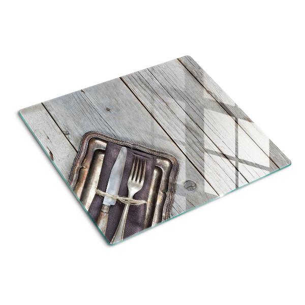 Glazen snijplanken Rustiek bestek op een houten achtergrond
