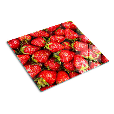 Glazen snijplanken Aardbeien op een rode achtergrond