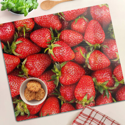 Glazen snijplanken Aardbeien op een rode achtergrond