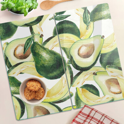 Snijplanken glas Avocado op een achtergrond van bladeren