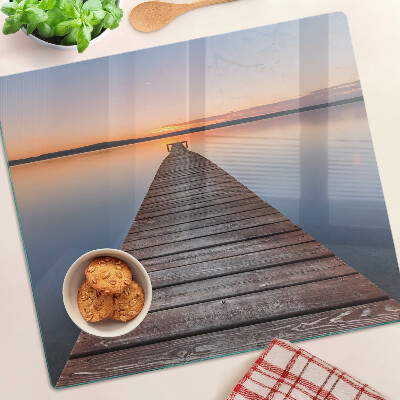 Glazen snijplanken Pier op het meer bij zonsondergang