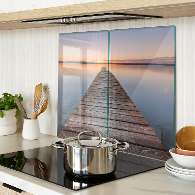 Glazen snijplanken Pier op het meer bij zonsondergang