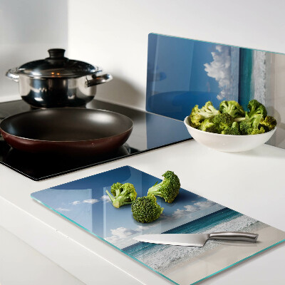 Snijplanken glas Strand met turquoise water en wolken