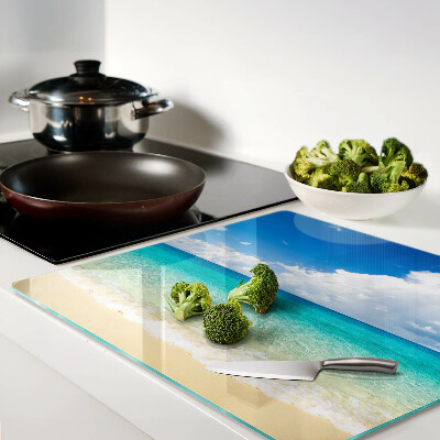Glazen snijplanken Strand met turquoise water en wolken