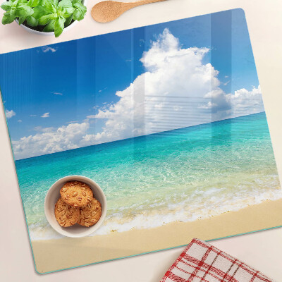 Glazen snijplanken Strand met turquoise water en wolken