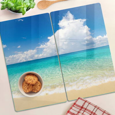 Glazen snijplanken Strand met turquoise water en wolken