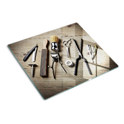 Snijplanken glas Kappersgereedschap op een houten achtergrond
