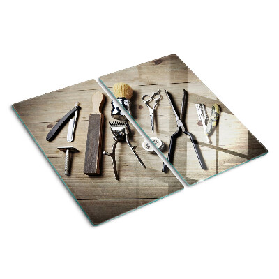 Snijplanken glas Kappersgereedschap op een houten achtergrond