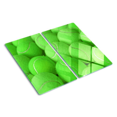Glazen snijplanken Tennisballen op een groene achtergrond