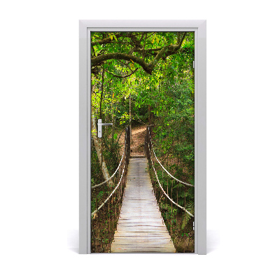 Deursticker Een brug opknoping in het bos