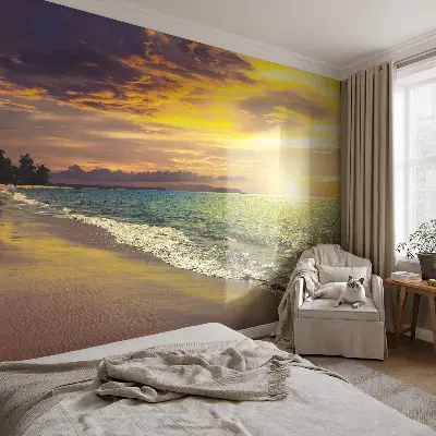Fotobehang vliesbehang met een strand bij zonsondergang