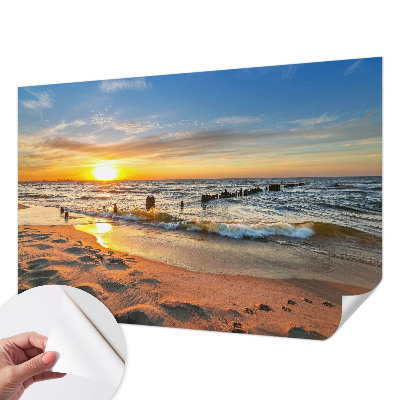 Foto behang voor de kinderkamer met een zonsondergang op het strand