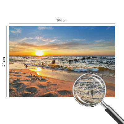 Foto behang voor de kinderkamer met een zonsondergang op het strand