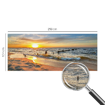 Foto behang voor de kinderkamer met een zonsondergang op het strand