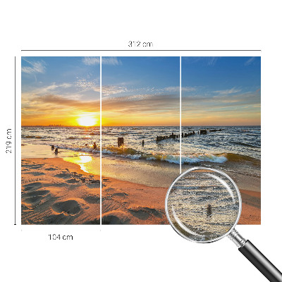 Foto behang voor de kinderkamer met een zonsondergang op het strand