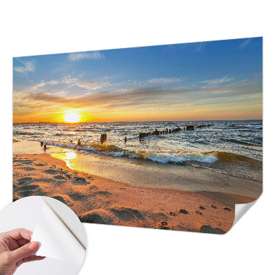 Foto behang voor de kinderkamer met een zonsondergang op het strand