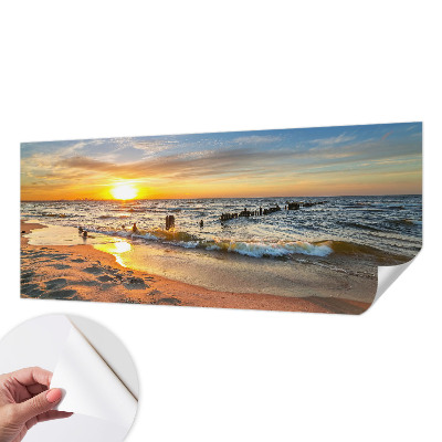Foto behang voor de kinderkamer met een zonsondergang op het strand