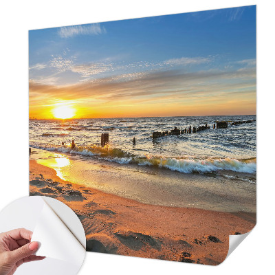Foto behang voor de kinderkamer met een zonsondergang op het strand