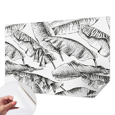 Fotobehang zelfklevend met een print van bananenbladeren
