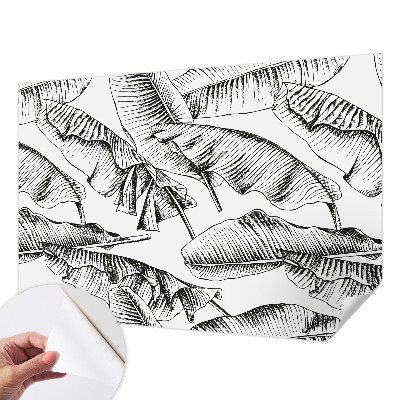Fotobehang zelfklevend met een print van bananenbladeren