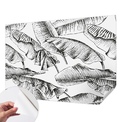 Fotobehang zelfklevend met een print van bananenbladeren