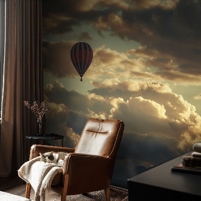 Fotobehang babykamer met een print van een ballon tussen de wolken
