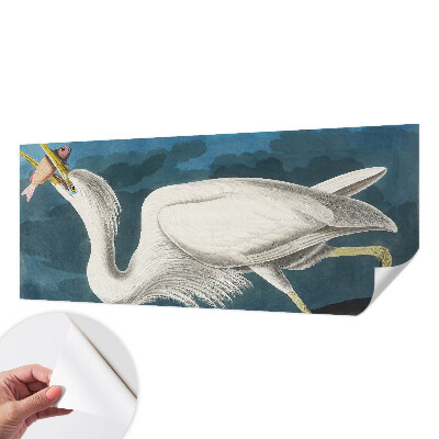 Foto behang voor de keuken met een vogel die een vis vasthoudt