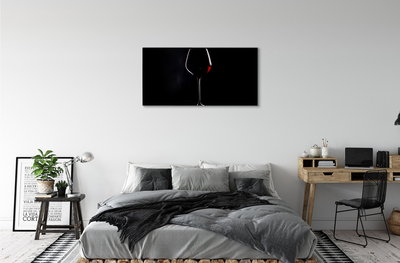 Canvas doek foto Zwarte achtergrond met wijnglas