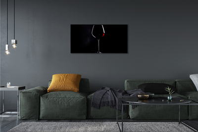 Canvas doek foto Zwarte achtergrond met wijnglas
