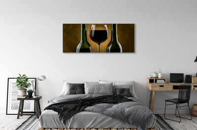 Canvas doek foto Een glas van 2 wijnflessen