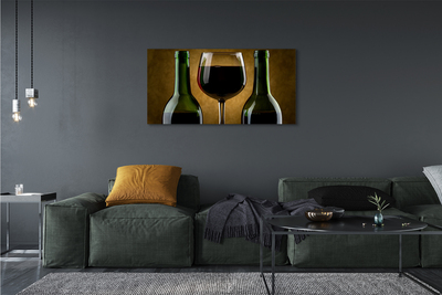 Canvas doek foto Een glas van 2 wijnflessen
