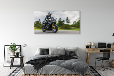 Schilderijen op canvas doek Motorfiets sky clouds road