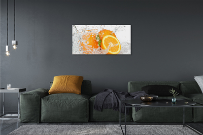 Canvas doek foto Sinaasappelen in water