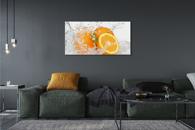 Canvas doek foto Sinaasappelen in water
