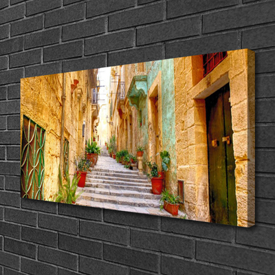 Canvas foto Old road town houses