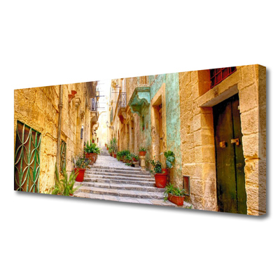 Canvas foto Old road town houses