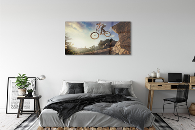 Schilderij op glas Bike mountains clouds sky