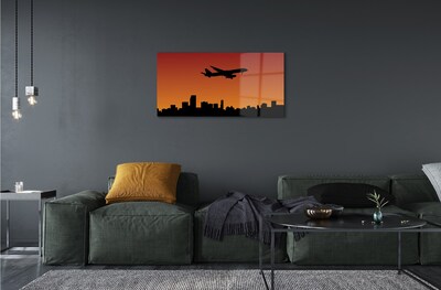 Schilderij op glas Zonsondergangvliegtuig en lucht