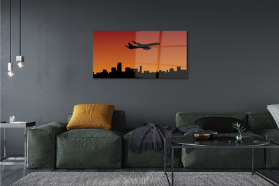 Schilderij op glas Zonsondergangvliegtuig en lucht