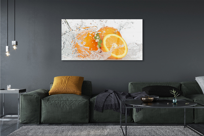 Schilderij op glas Sinaasappelen in water