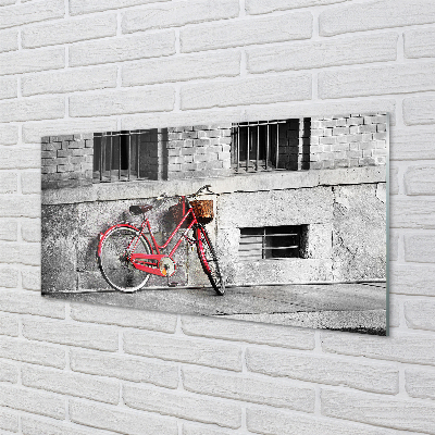 Spatplaat keuken glas Rode fiets met een mand