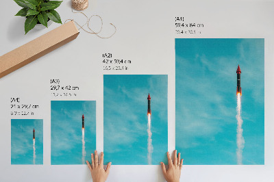 Wandposter Een raket die opstijgt in de blauwe lucht.